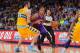 DENVER, CO - APRIL 17: Michael Beasley #0 of the Phoenix Suns controls the ball against Kosta Koufos #41 of the Denver Nuggets at the Pepsi Center on April 17, 2013 in Denver, Colorado. The Nuggets defeated the Suns 118-98. NOTE TO USER: User expressly a