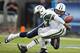 NASHVILLE, TN - SEPTEMBER 29: Karl Klug #97 of the Tennessee Titans strips the ball loose from Geno Smith #7 of the New York Jets at LP Field on September 29, 2013 in Nashville, Tennessee. The Titans defeated the Jets 38-13. (Photo by Wesley Hitt/Getty