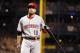 Oct 1, 2013; Pittsburgh, PA, USA; Cincinnati Reds first baseman Joey Votto (19) reacts after striking out against the Pittsburgh Pirates in the sixth inning of the National League wild card playoff baseball game at PNC Park. The Pirates won 6-2. Mandatory