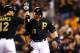PITTSBURGH, PA - OCTOBER 01: Russell Martin #55 celebrates his solo home run with Clint Barmes #12 of the Pittsburgh Pirates in the second inning against the Cincinnati Reds during the National League Wild Card game at PNC Park on October 1, 2013 in Pitt