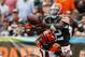 CLEVELAND, OH - SEPTEMBER 29: Wide receiver Josh Gordon #12 of the Cleveland Browns makes catch over cornerback Adam Jones #24 of the Cincinnati Bengals at FirstEnergy Stadium on September 29, 2013 in Cleveland, Ohio. (Photo by Matt Sullivan/Getty Image
