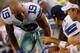 ARLINGTON, TX - OCTOBER 01: Miles Austin #19 of the Dallas Cowboys talks with Tony Romo #9 of the Dallas Cowboys after Romo threw his fifth interception against the Chicago Bears at Cowboys Stadium on October 1, 2012 in Arlington, Texas. (Photo by Tom P