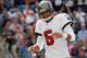 FOXBORO, MA - SEPTEMBER 22: Josh Freeman #5 of the Tampa Bay Buccaneers reacts after throwing an incomplete pass in the second half against the New England Patriots at Gillette Stadium on September 22, 2013 in Foxboro, Massachusetts. (Photo by Jim Rogash