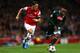 LONDON, ENGLAND - OCTOBER 01: Mesut Oezil of Arsenal goes past Camilo Zuniga of Napoli during UEFA Champions League Group F match between Arsenal FC and SSC Napoli at Emirates Stadium on October 1, 2013 in London, England. (Photo by Paul Gilham/Getty Im