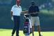 DUBLIN, OH - OCTOBER 01: Phil Mickelson of the U.S. Team waits with his caddie Jim Mackay during a practice round prior to the start of The Presidents Cup at the Muirfield Village Golf Club on October 1, 2013 in Dublin, Ohio. (Photo by Andy Lyons/Getty