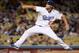 LOS ANGELES, CA - SEPTEMBER 27: Clayton Kershaw #22 of the Los Angeles Dodgers pitches against the Colorado Rockies during the first inning at Dodger Stadium on September 27, 2013 in Los Angeles, California. (Photo by Harry How/Getty Images)
