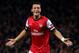 LONDON, ENGLAND - OCTOBER 01: Mesut Oezil of Arsenal celebrates after scoring the opening goal during UEFA Champions League Group F match between Arsenal FC and SSC Napoli at Emirates Stadium on October 1, 2013 in London, England. (Photo by Paul Gilham/