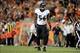 Sep 5, 2013; Denver, CO, USA; Baltimore Ravens inside linebacker Josh Bynes (56) reacts after a blocked punt in the third quarter against the Denver Broncos at Sports Authority Field at Mile High. Mandatory Credit: Ron Chenoy-USA TODAY Sports