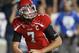 PROVO, UT - SEPTEMBER 21: Quarterback of the Utah Utes Travis Wilson #7 takes a knee during a game against the BYU Cougars during the first half of an NCAA football game September 21, 2013 at LaVell Edwards Stadium in Provo, Utah. (Photo by George Frey/Ge