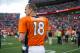 DENVER, CO - SEPTEMBER 29: Quarterback Peyton Manning #18 of the Denver Broncos walks off of the field after the win over the Philadelphia Eagles at Sports Authority Field Field at Mile High on September 29, 2013 in Denver, Colorado. (Photo by Dustin Br