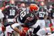 CLEVELAND, OH - SEPTEMBER 29: Wide receiver Josh Gordon #12 of the Cleveland Browns dives over cornerbacks Leon Hall #29 and Terence Newman #23 of the Cincinnati Bengals at FirstEnergy Stadium on September 29, 2013 in Cleveland, Ohio. (Photo by Matt Sul