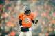 Jan 12, 2013; Denver, CO, USA; Denver Broncos quarterback Peyton Manning (18) reacts in the first half against the Baltimore Ravens during the AFC divisional round playoff game at Sports Authority Field. Mandatory Credit: Mark J. Rebilas-USA TODAY Sports