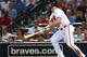 ATLANTA, GA - SEPTEMBER 03: Left fielder Evan Gattis #24 of the Atlanta Braves follows through on a swing for a game tying home run in the seventh inning during the game against the New York Mets at Turner Field on September 3, 2013 in Atlanta, Georgia.