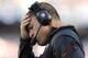 FOXBORO, MA - SEPTEMBER 22: Head coach Greg Schiano holds his head during the fourth quarter of their 23-3 loss to the New England Patriots at Gillette Stadium on September 22, 2013 in Foxboro, Massachusetts. (Photo by Winslow Townson/Getty Images)
