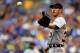 KANSAS CITY, MO - JULY 20: Starting pitcher Justin Verlander #35 of the Detroit Tigers reaches for the ball after giving up a walk during the game against the Kansas City Royals at Kauffman Stadium on July 20, 2013 in Kansas City, Missouri. (Photo by Ja