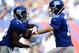 EAST RUTHERFORD, NJ - SEPTEMBER 15: Eli Manning #10 of the New York Giants hands the ball off to David Wilson #22 during the first quarter against the Denver Broncos at MetLife Stadium on September 15, 2013 in East Rutherford, New Jersey. (Photo by Madd