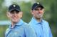 DUBLIN, OH - OCTOBER 01: Charl Schwartzel and Louis Oosthuizen of South Africa and the International Team in action during a practice round prior to the start of The Presidents Cup at the Muirfield Village Golf Club on October 1, 2013 in Dublin, Ohio. (