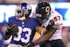 EAST RUTHERFORD, NJ - AUGUST 24: Dante Hughes #33 of the New York Giants carries the ball as Xavier Adibi #57 of the Chicago Bears tackles during a preseason game on August 24, 2012 at MetLife Stadium in East Rutherford, New Jersey.The Chicago Bears def