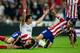 MADRID, SPAIN - SEPTEMBER 28: Gareth Bale (2ndL) of Real Madrid CF protests after clashing with Diego Godin (L) and Filipe Luis (R) of Atletico de Madrid during the La Liga match between Real Madrid CF and Club Atletico de Madrid at Estadio Santiago Berna