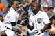 DETROIT, MI - AUGUST 29: Torii Hunter #48 of the Detroit Tigers is greeted at home plate by Victor Martinez #41 after hitting a three-run, walk-off, home run to defeat the Oakland Athletics 7-6 at Comerica Park on August 29, 2013 in Detroit, Michigan. (P