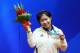 GUANGZHOU, CHINA - NOVEMBER 21: Wing Chi Annie Au of Hong Kong celebrates wining the gold medal of the Women's Individual Final squash match at Asian Games Town Gymnasium during day nine of the 16th Asian Games Guangzhou 2010 on November 21, 2010 in Guan