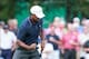 Oct 3, 2013; Dublin, OH, USA; Tiger Woods reacts to his putt on the sixth green during the Thursday four ball matches of the Presidents Cup at Muirfield Village Golf Club. Mandatory Credit: Allan Henry-USA TODAY Sports