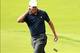 Oct 3, 2013; Dublin, OH, USA; Matt Kuchar tips his hat to the gallery on the first green during the Thursday four ball matches of the Presidents Cup at Muirfield Village Golf Club. Mandatory Credit: Allan Henry-USA TODAY Sports