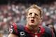 HOUSTON, TX- SEPTEMBER 29: J.J. Watt #99 of the Houston Texans leaves the field after losing to the Seattle Seahawks on September 29, 2013 at Reliant Stadium in Houston, Texas. (Photo by Thomas B. Shea/Getty Images)