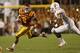 AMES, IA - OCTOBER 3: Running back Aaron Wimberly #2 of the Iowa State Cyclones rushes for yards against linebacker Peter Jinkens #19 of the Texas Longhorns in the first half of play at Jack Trice Stadium on October 3, 2013 in Ames, Iowa. (Photo by David
