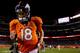 DENVER, CO - AUGUST 24: Quarterback Peyton Manning #18 of the Denver Broncos runs off the field after the Broncos defeated the St. Louis Rams 27-26 at Sports Authority Field Field at Mile High on August 24, 2013 in Denver, Colorado. (Photo by Justin Edm