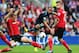 CARDIFF, WALES - SEPTEMBER 22: Andros Townsend of Tottenham Hotspur is blocked by Ben Turner (L) and Aron Gunnarsson of Cardiff City (R) during the Barclays Premier League match between Cardiff City and Tottenham Hotspur at Cardiff City Stadium on Septem