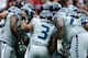 HOUSTON, TX - SEPTEMBER 29: Russell Wilson #3 of the Seattle Seahawks calls a play in the huddle against the Houston Texans at Reliant Stadium on September 29, 2013 in Houston, Texas. (Photo by Scott Halleran/Getty Images)