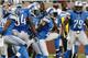 DETROIT, MI - SEPTEMBER 29: Louis Delmas #26 of the Detroit Lions celebrates his third quarter interception with teammates while playing the Chicago Bears at Ford Field on September 29, 2013 in Detroit, Michigan. Detroit won the game 40-32. (Photo by Greg