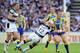HUDDERSFIELD, ENGLAND - JULY 28: Ben Westwood (R) of Warrington Wolves is tackled by Danny Tickle of Hull FC during the Tetley's Challenge Cup Semi Final between Hull FC and Warrington Wolves at John Smith's Stadium on July 28, 2013 in Huddersfield, Engl