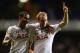 LONDON, ENGLAND - SEPTEMBER 19: Christian Eriksen of Spurs celebrates scoring their third goal with Kyle Naughton of Spurs during the UEFA Europa League Group K match between Tottenham Hotspur FC and Tromso IL at White Hart Lane on September 19, 2013 in