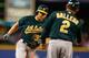 SEATTLE, WA - SEPTEMBER 28: Brandon Moss #37 of the Oakland Athletics is congratulated by third base coach Mike Gallego #2 after hitting a two-run home run against the Seattle Mariners in the seventh inning at Safeco Field on September 28, 2013 in Seattl