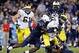 Sep 21, 2013; East Hartford, CT, USA; Connecticut Huskies linebacker Yawin Smallwood (33) forces the fumble as he sacks Michigan Wolverines quarterback Devin Gardner (98) in the second half at Rentschler Field. Gardner recovered the ball. Michigan Wolveri
