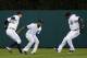 DETROIT, MI - SEPTEMBER 16: Don Kelly #32, Austin Jackson #14 and Torii Hunter #48 of the Detroit Tigers prepare for their celebratory jump in the outfield after a 4-2 win over the Seattle Mariners at Comerica Park on September 16, 2013 in Detroit, Michi
