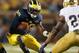 ANN ARBOR, MI - SEPTEMBER 07: Devin Gardner #98 of the Michigan Wolverines looks to make a move on Elijah Shumate #22 of the Notre Dame Fighting Irish at Michigan Stadium on September 7, 2013 in Ann Arbor, Michigan. (Photo by Gregory Shamus/Getty Images)