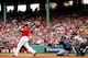 BOSTON, MA - OCTOBER 04: Jonny Gomes #5 of the Boston Red Sox hits a two run double against the Tampa Bay Rays in the fourth inning during Game One of the American League Division Series at Fenway Park on October 4, 2013 in Boston, Massachusetts. (Photo