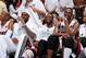 MIAMI, FL - JUNE 9: Chris Bosh #1, LeBron James #6, and Dwyane Wade #3 of the Miami Heat share a laugh on the bench during Game Two of the 2013 NBA Finals against the San Antonio Spurs on June 9, 2013 at American Airlines Arena in Miami, Florida. NOTE TO