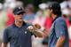 DUBLIN, OH - OCTOBER 04: Graham DeLaet of Canada and Jason Day of Australia and the International Team react to a birdie putt on the second hole during the Day Two Foursome Matches at the Muirfield Village Golf Club on October 4, 2013 in Dublin, Ohio.