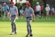 Oct 4, 2013; Dublin, OH, USA; Phil Mickelson and Keegan Bradley walk down fairwau during the second round of the President's Cup at Muirfield Village Golf Club. Mandatory Credit: Brian Spurlock-USA TODAY Sports