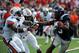 October 13, 2012; Oxford, MS, USA; Mississippi Rebels running back Jeff Scott (3) tries to get away from Auburn Tigers defensive back Jermaine Whitehead (9) during their game at Vaught-Hemingway Stadium. Mandatory Credit: Chuck Cook - USA TODAY Sports