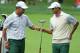 DUBLIN, OH - OCTOBER 03: Hideki Matsuyama of Japan (L) and Adam Scott of Australia and the International Team react to a shot on the second hole during the Day One Four-Ball Matches at the Muirfield Village Golf Club on October 3, 2013 in Dublin, Ohio.