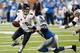DETROIT, MI - SEPTEMBER 29: Jay Cutler #6 of the Chicago Bears tries to escape the fourth quarter tackle of Willie Young #79 of the Detroit Lions at Ford Field on September 29, 2013 in Detroit, Michigan. Detroit won the game 40-32. (Photo by Gregory Shamu