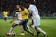 MARSEILLE, FRANCE - SEPTEMBER 18: Theo Walcott of Arsenal battles with Lucas Mendez of Olympique de Marseilleduring the UEFA Champions League group F match between Olympique de Marseille and Arsenal at Stade Velodrome on September 18, 2013 in Marseille,