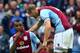 BIRMINGHAM, ENGLAND - SEPTEMBER 28: Leandro Bacuna of Aston Villa celebrates victory with Ron Vlaar during the Barclays Premier League match between Aston Villa and Manchester City at Villa Park on September 28, 2013 in Birmingham, England. (Photo by Ja