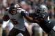 Nov 4, 2012; Oakland, CA, USA; Tampa Bay Buccaneers quarterback Josh Freeman (5) is pressured by Oakland Raiders defensive tackle Tommy Kelly (93) at the O.co Coliseum. Mandatory Credit: Kirby Lee/Image of Sport-USA TODAY Sports