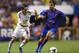 VALENCIA, BARCELONA - OCTOBER 05: Di Maria (L) of Real Madrid competes for the ball with Christian Lell of Levante UD during the La Liga match between Levante UD and Real Madrid at Ciutat de Valencia on October 5, 2013 in Valencia, Spain. (Photo by Man